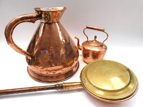 A large Victorian copper 3 gallon measuring jug, a Victorian copper kettle and a Victorian bed pan.