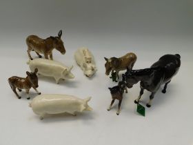 Collection of eight Beswick animals to include horses, pigs and donkeys, seven boxed.