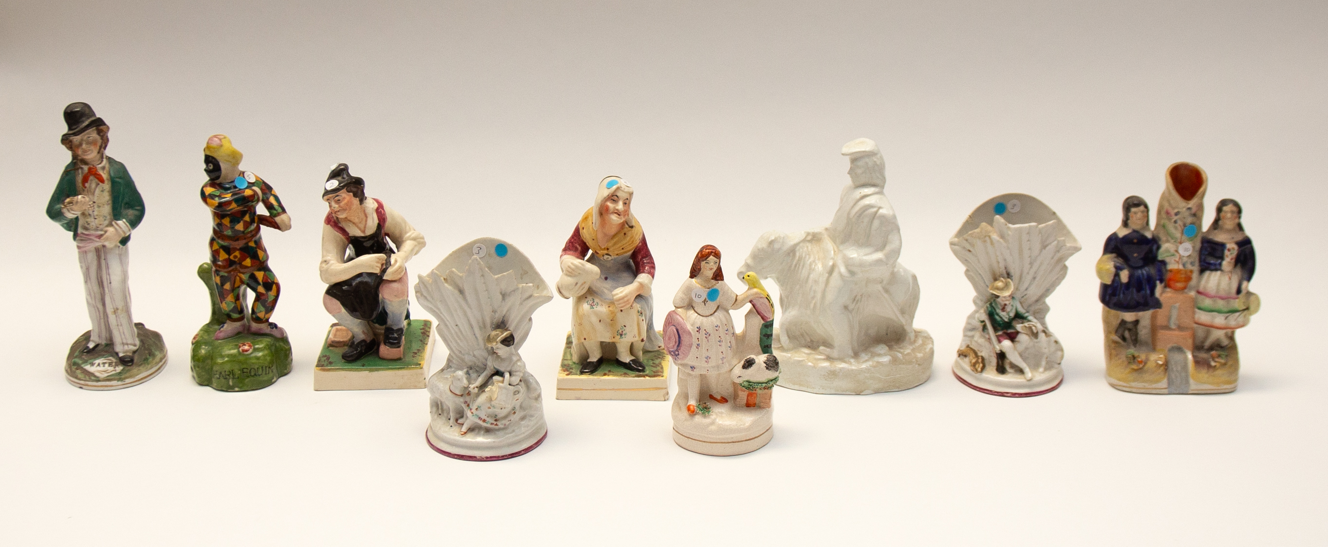 Collection of mixed 19th century and 20th century Staffordshire figures to include pairs, spills and