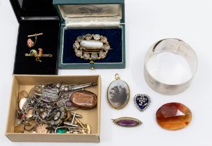 A collection of costume jewellery, comprising a wide engine turned silver cuff bangle, Victorian