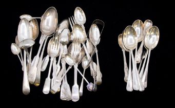 A collection of 19th and early 20th Century silver flatware to include table spoons, dessert spoons,