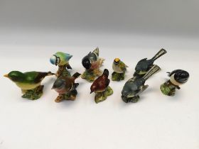 A collection of 9 Beswick birds to include wren, chaffinch, gold crest etc. (9)