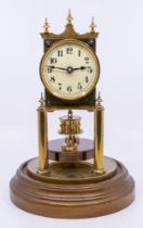 An early 20th century Gustav Becker German domed clock, brass workings, enamel dial and with glass