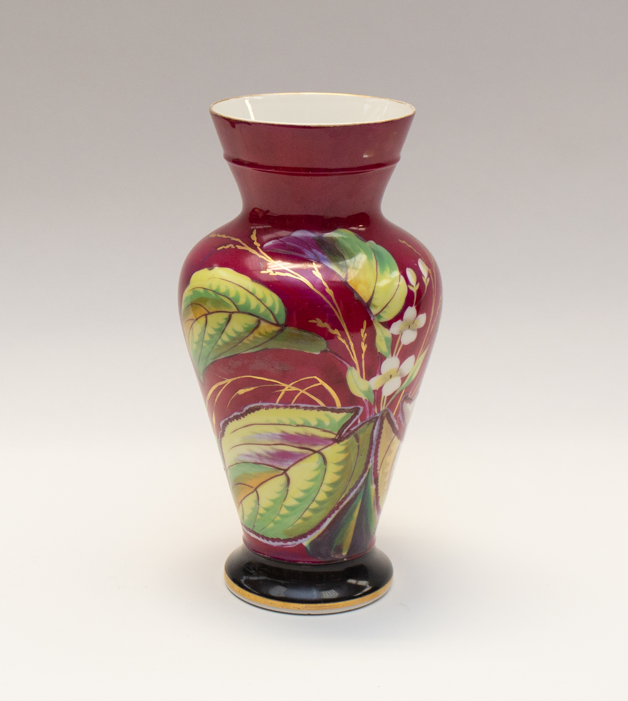 Late 19th century/ early 20th century single continental porcelain vase with foliage detail