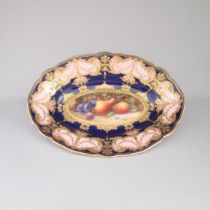 A Royal Worcester Oval Dessert Dish, painted with fruit, Pears and plums, within pink, cobalt blue