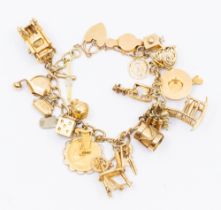 A 9ct gold charm bracelet with padlock clasp, suspending various 9ct gold and yellow metal charms,