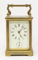 Early 20th century French brass carriage clock with second dial, Arabic and Roman numerals, glazed