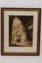 An early 20th century watercolour of church ruins together with a round marble plaque in a frame