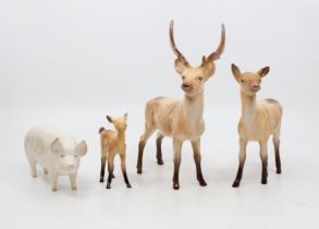 Collection of Beswick deers along with a Beswick pig.