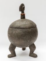 A West Africa Bambara type wooden lidded bowl, of spherical shape, incised detail, on three feet,