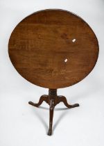 George III round oak tilt top table.