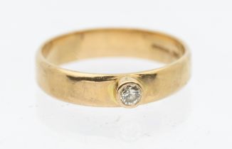 A 9ct gold and diamond dress ring, comprising a collet set round brilliant cut diamond approx 0.