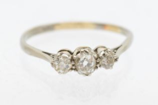 A diamond and platinum three stone ring, comprising graduiated old European cut diamonds, total
