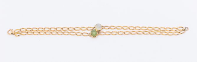 A yellow gold and stone set bracelet, comprising an oval cabochon moonstone and green chalcedony,