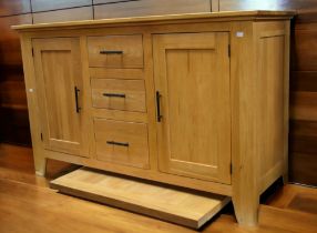 A 20th century light oak kitchen table with pull out leaves on block legs 150cm x 90cm. each leaf