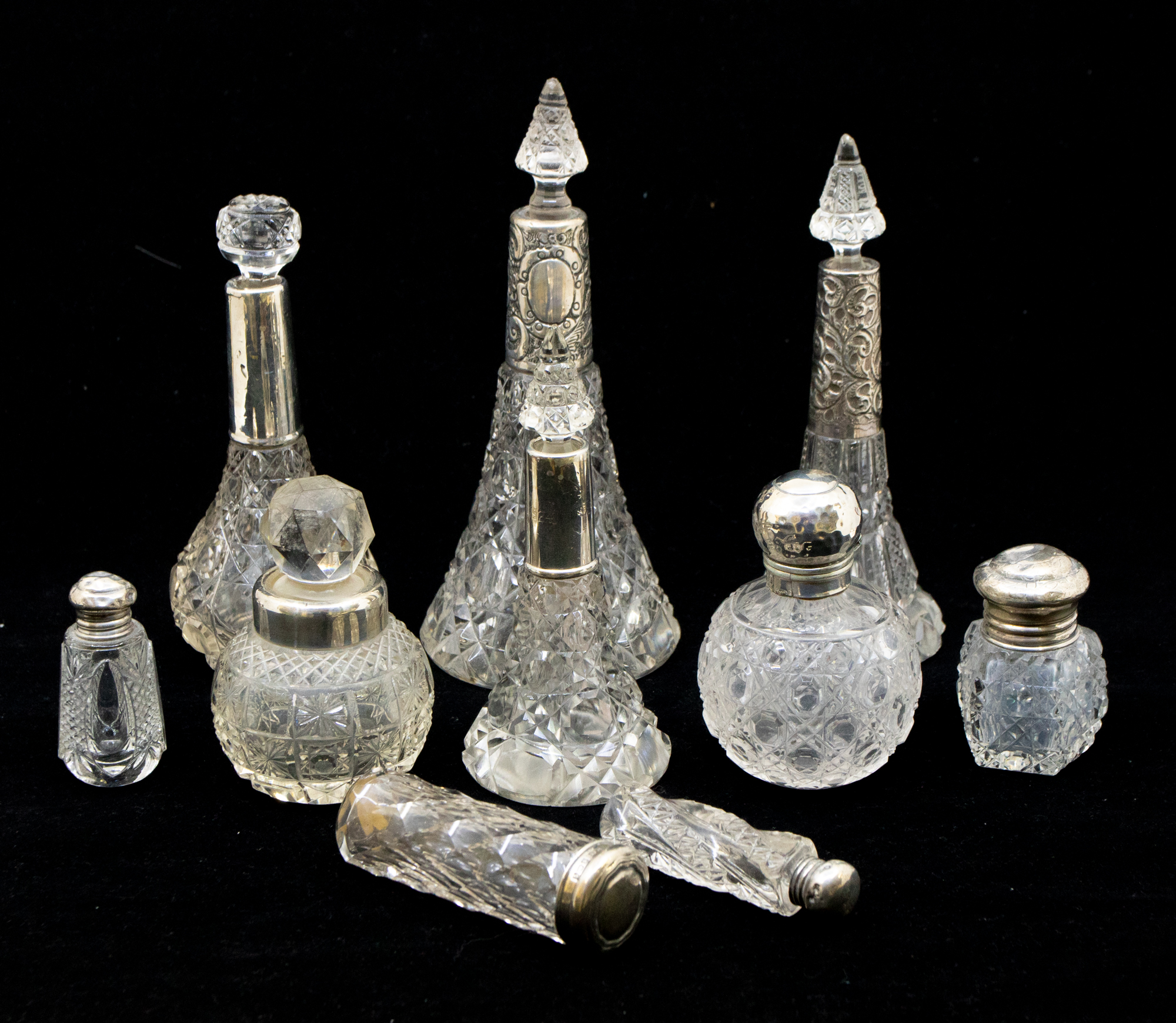 A collection of mixed silver topped or collared cut glass perfume bottles to include; three - Image 2 of 2