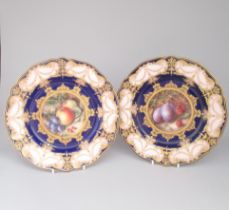 Two Royal Worcester Dessert plates, painted with fruit. One painted with apples, grapes and red