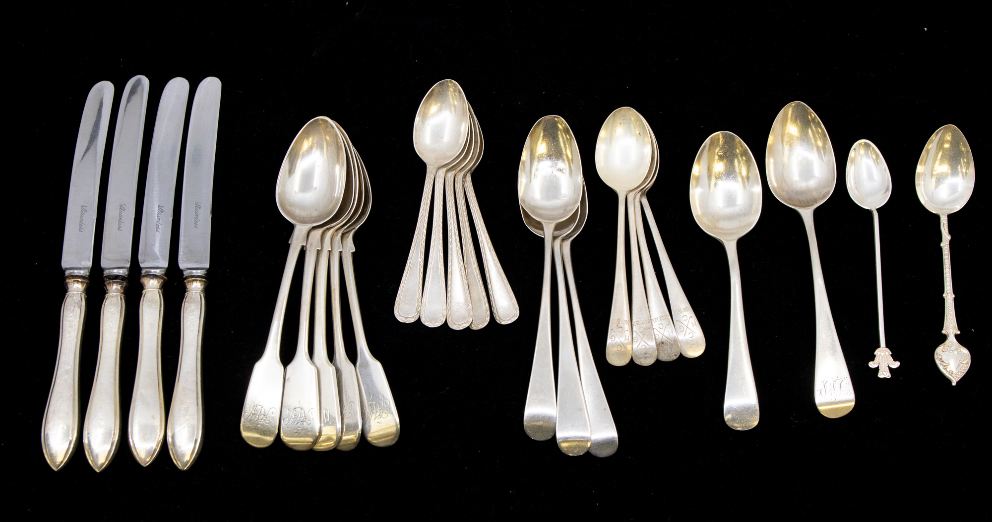 A collection of mixed silver flatware to include; three matching Victorian fiddle patterned