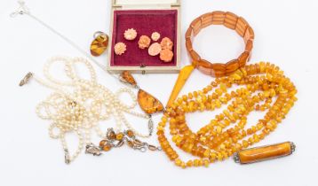 A collection of amber jewellery to include a a silver and amber drop pendant, silver and amber