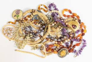 A collection of various costume jewellery to include an amber bead necklace, along with two cultured