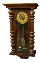 Two late 19th century German 8 day wall clocks with Roman numerals in mahogany cases.