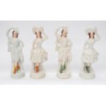 Four similar Staffordshire figures, all Ladies in white dress and hand on hats. Some cracking, wear,