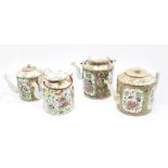 A collection of four famille rose teapots, export ware c.1860-70, two with wire handles.