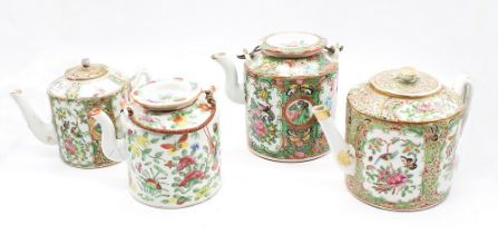 A collection of four famille rose teapots, export ware c.1860-70, two with wire handles.