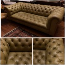 Pale Mustard buttoned back and seat Chesterfield sofa on turned mahogany legs supported by brass