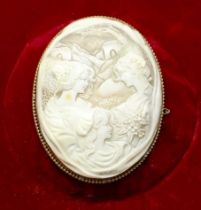 Large Victorian Shell Cameo brooch depicting three ladies with sharp detail. Two of the ladies are