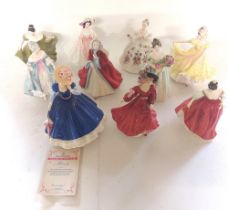 A collection of Royal Doulton ladies, one of which was figure of the year for 1992, comes with