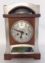 A German oak cased secessionist 14 day strike mantel clock, made in Wurttemburg. with a raised bell