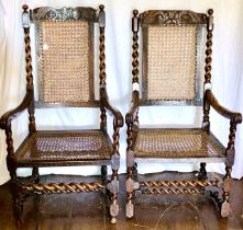 Two similar Carolean oak and cane work armchairs, foliage carved rail flanked by globe finials on