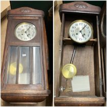 Oak Wall clock complete with pendulum and keys, arts and crafts styling  not tested.