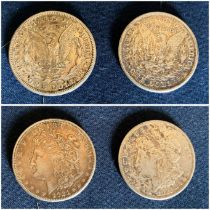 Two 1921 Dollar coins.