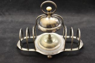 A late 19th/early  20th century combined plated toast rack, butter dish and bell, 23cm wide