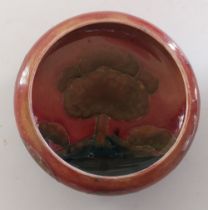 A Moorcroft Eventide pin dish, C1916 with WM Blue signature, measures 11cm in diameter and 4 cm in