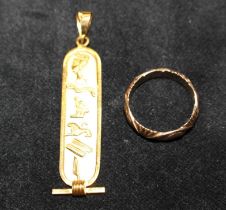 Two pieces of yellow metal jewellery featuring an Egyptian cartouche pendant and a patterned band