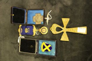 An assortment of badges and miscellaneous . Five pieces in total.  To include a Silver 'RAF'