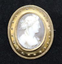 5.) 14ct Gold '14' stamped Shell Cameo Brooch depicting a lady. Measures approx 25mm in length by