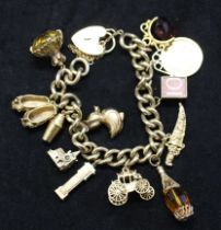 9ct Gold Charm Bracelet with 11 charms and a 22ct Gold Sovereign dated 1900 and 'P' for Perth Mint