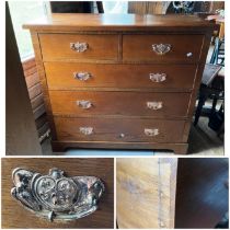 An Arts and crafts Oak chest or two small over three long drawers with Art Nouveaux copper drawer