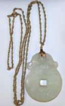 Pale Jade Pendant with 9ct Gold Chain. Jade pendant is approx 4.5cm height by approx 3cm width