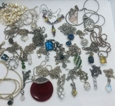 A collection of 27 pendants and two necklaces in 925. Mostly featuring gem set pendants, each with a