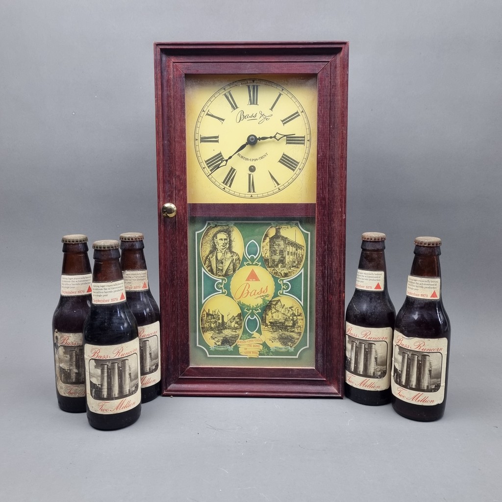 A Bass Brewery advertising clock along with 5 bottles of Beer commemorating "2 Million Bottles at