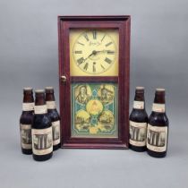 A Bass Brewery advertising clock along with 5 bottles of Beer commemorating "2 Million Bottles at