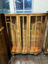 Satinwood serpentine fronted glazed china cabinet with short cabriole legs  plus one other (some