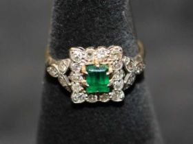 Art Deco Emerald and Diamond cluster ring.  The Emerald is emerald cut and is approx 0.42ct.
