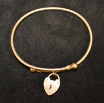9ct Rose Gold Bangle with a unmarked rose coloured metal padlock fastening.  The bangle is