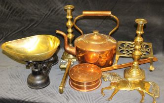 A Victorian oval copper kettle, a pair of Victorian brass ejector candlesticks, a brass trivet, a